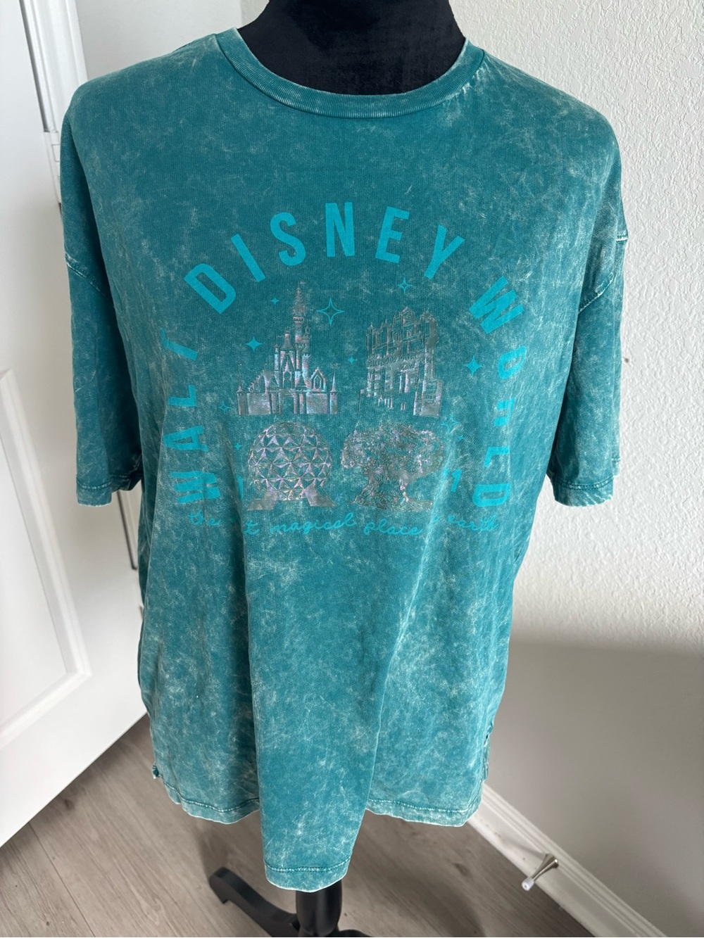 Disney Parks Walt Disney World 4-Park Icon Tee in a teal acid wash color